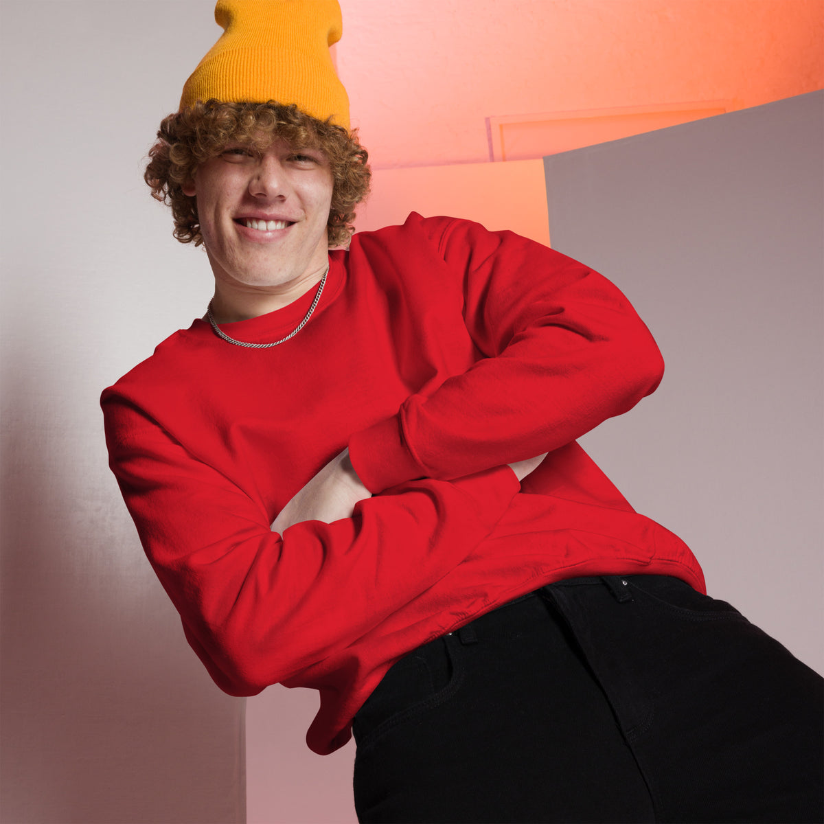 Model wearing front facing graphic sweatshirt in color red, from What Was Said (Statement Apparel + More). 