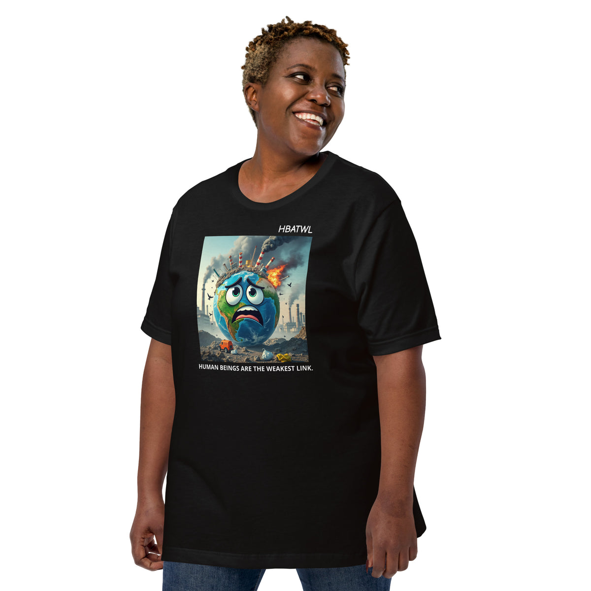 Model is wearing left front facing graphic T-shirt in color black featuring an animated earth with facial expression of concern over being negatively effected by human pollution. Bold statement on the shirt reads, 'Human Beings Are The Weakest link.', in white print. From What Was Said (Statement Apparel + More). 