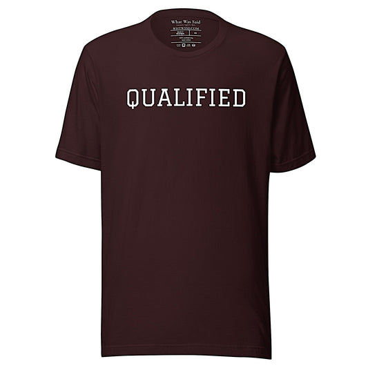 Front-facing graphic T-shirt in color oxblood dark reddish black, featuring the word 'QUALIFIED' in bold white print, from What Was Said (Statement Apparel + More).