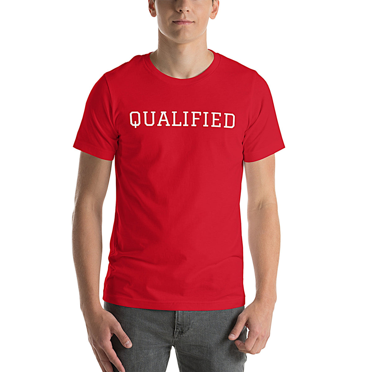 Model wearing front-facing graphic T-shirt in color red featuring the word 'QUALIFIED' in bold white print, from What Was Said (Statement Apparel + More).
