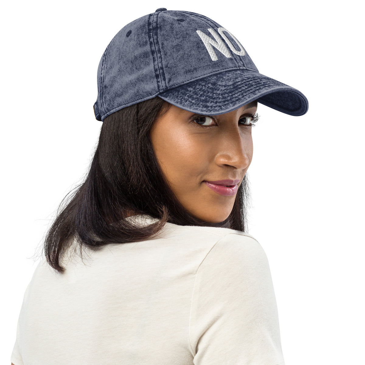 Model is wearing right front facing vintage graphic cotton twill cap in color navy blue wash, featuring the statement 'NO.' in bold white embroidery. From What Was Said (Statement Apparel + More).