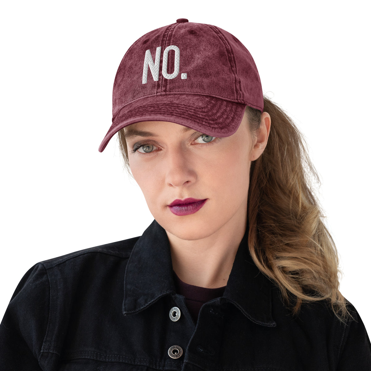 Model is wearing front facing vintage graphic cotton twill cap in color maroon red wash, featuring the statement 'NO.' in bold white embroidery. From What Was Said (Statement Apparel + More).